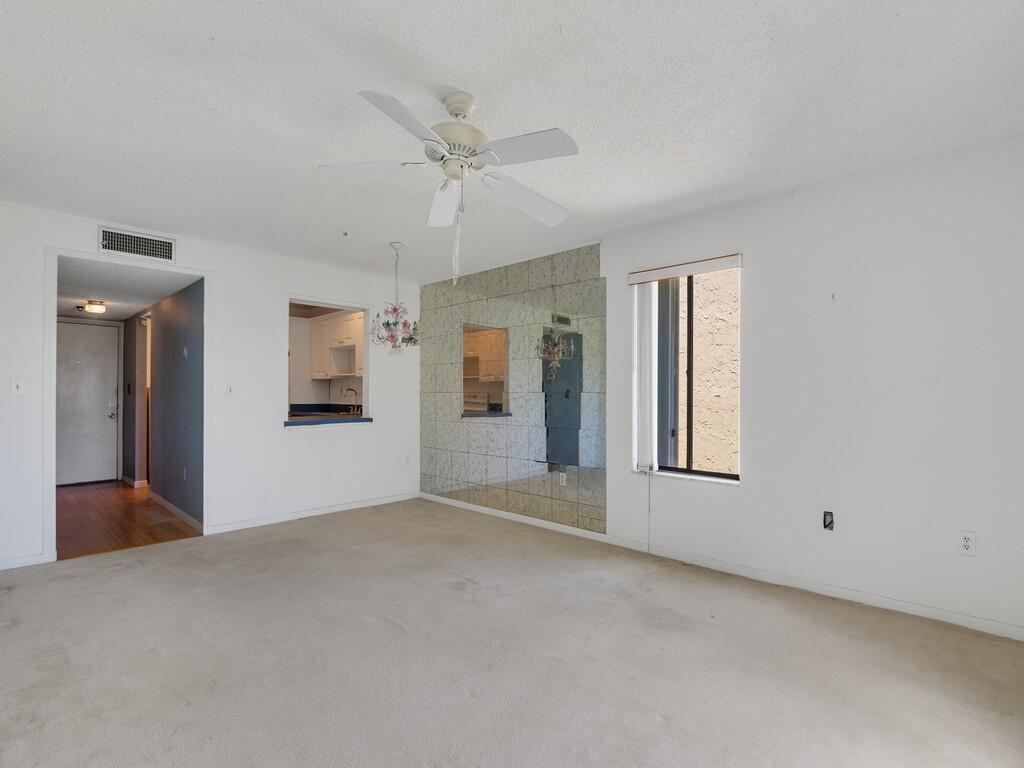 5373 Southeast Miles Grant Road, Unit 208 Stuart, FL 34997 - Photo 7 of 32 a view of an empty room with a window