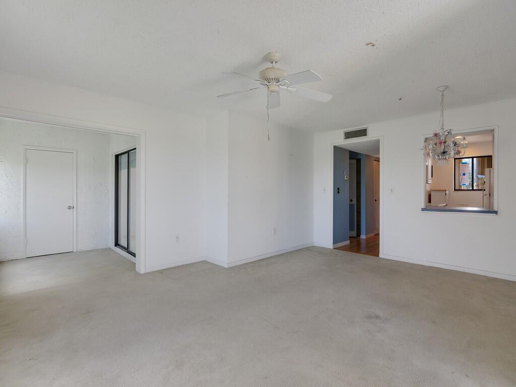 5373 Southeast Miles Grant Road, Unit 208 Stuart, FL 34997 - Photo 8 of 32 a view of an empty room with a window