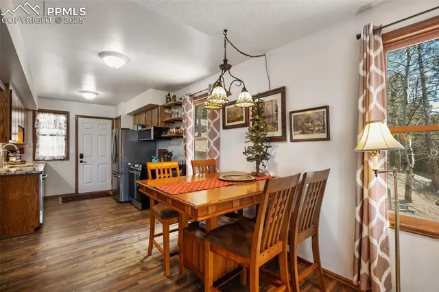 a dining room with furniture and window