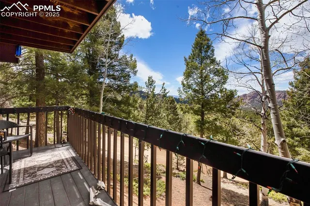 a view of a balcony with wooden fence