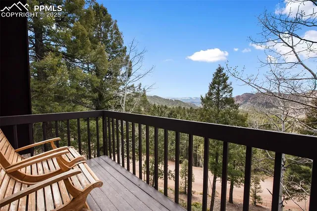 a view of a two chairs in the balcony