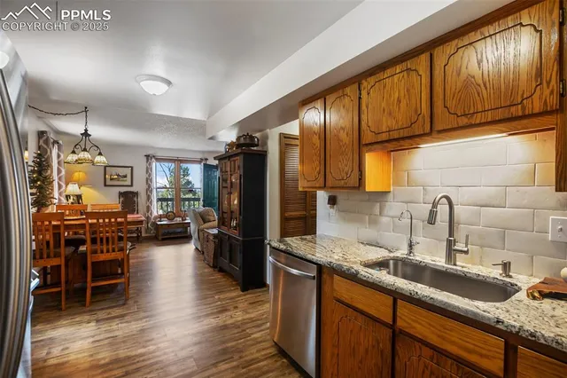 a kitchen with lots of counter top space and stainless steel appliances