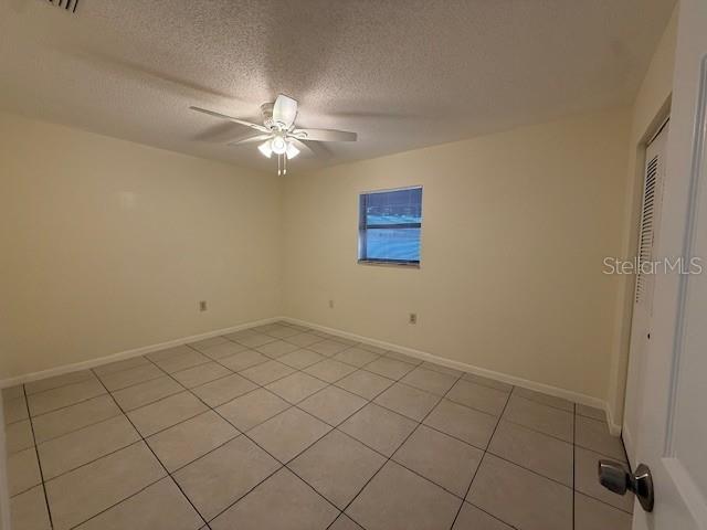 1029 10th Street Northwest, Unit B Largo, FL 33770 - Photo 11 of 20 a view of an empty room and chandelier fan