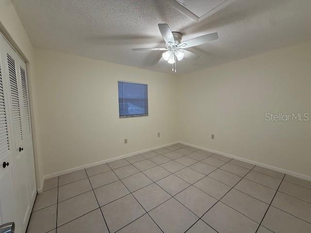 1029 10th Street Northwest, Unit B Largo, FL 33770 - Photo 13 of 20 a view of an empty room and chandelier fan