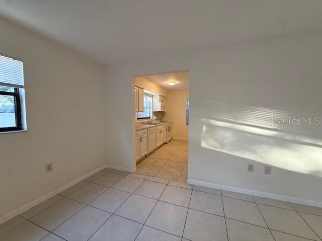 1029 10th Street Northwest, Unit B Largo, FL 33770 - Photo 4 of 20 a view of a kitchen with a sink and dishwasher cabinets