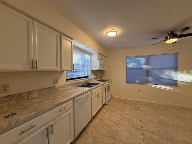 1029 10th Street Northwest, Unit B Largo, FL 33770 - Photo 6 of 20 a kitchen with a sink and cabinets
