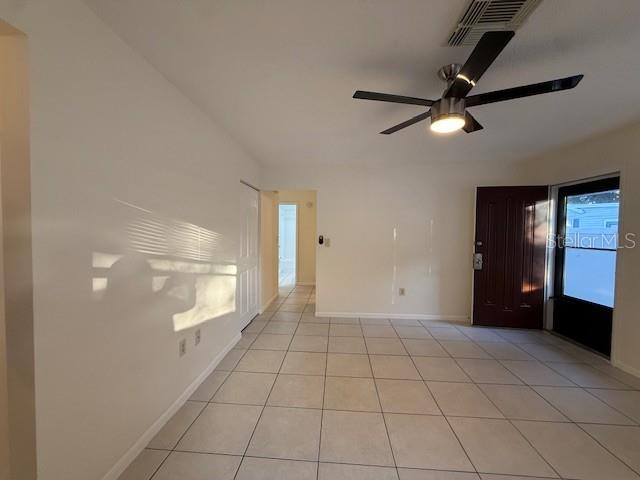 1029 10th Street Northwest, Unit B Largo, FL 33770 - Photo 9 of 20 a view of an empty room with glass door