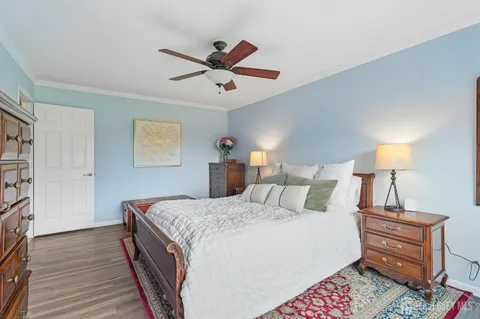 a bedroom with a bed and dresser