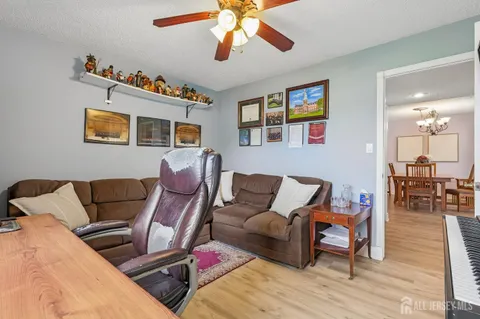 a view of a livingroom with workspace and a couch