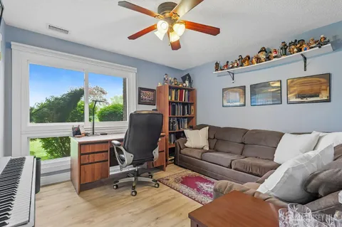 a room with furniture and flat screen tv