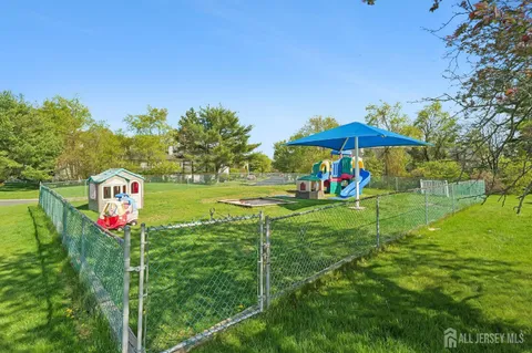 a view of a swimming pool and a yard
