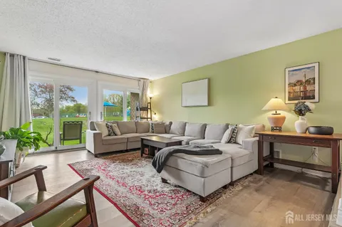a living room with furniture and a rug
