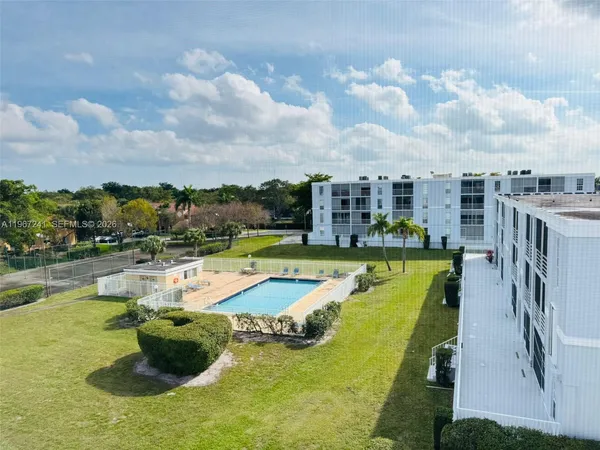 a view of a swimming pool with a lounge chair