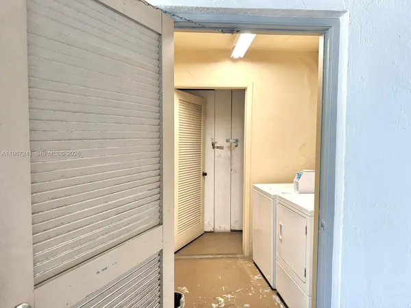 a view of a bathroom from a hallway