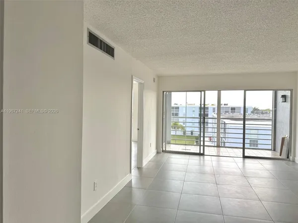 a view of an empty room and window