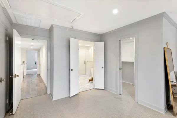 a spacious bathroom with a double vanity sink and a mirror