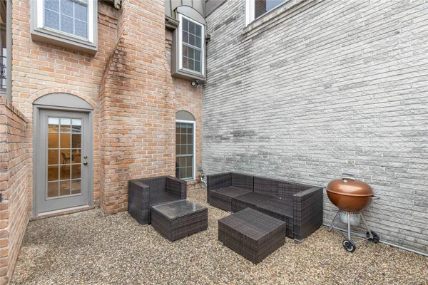 a brick building with a bench in front of it