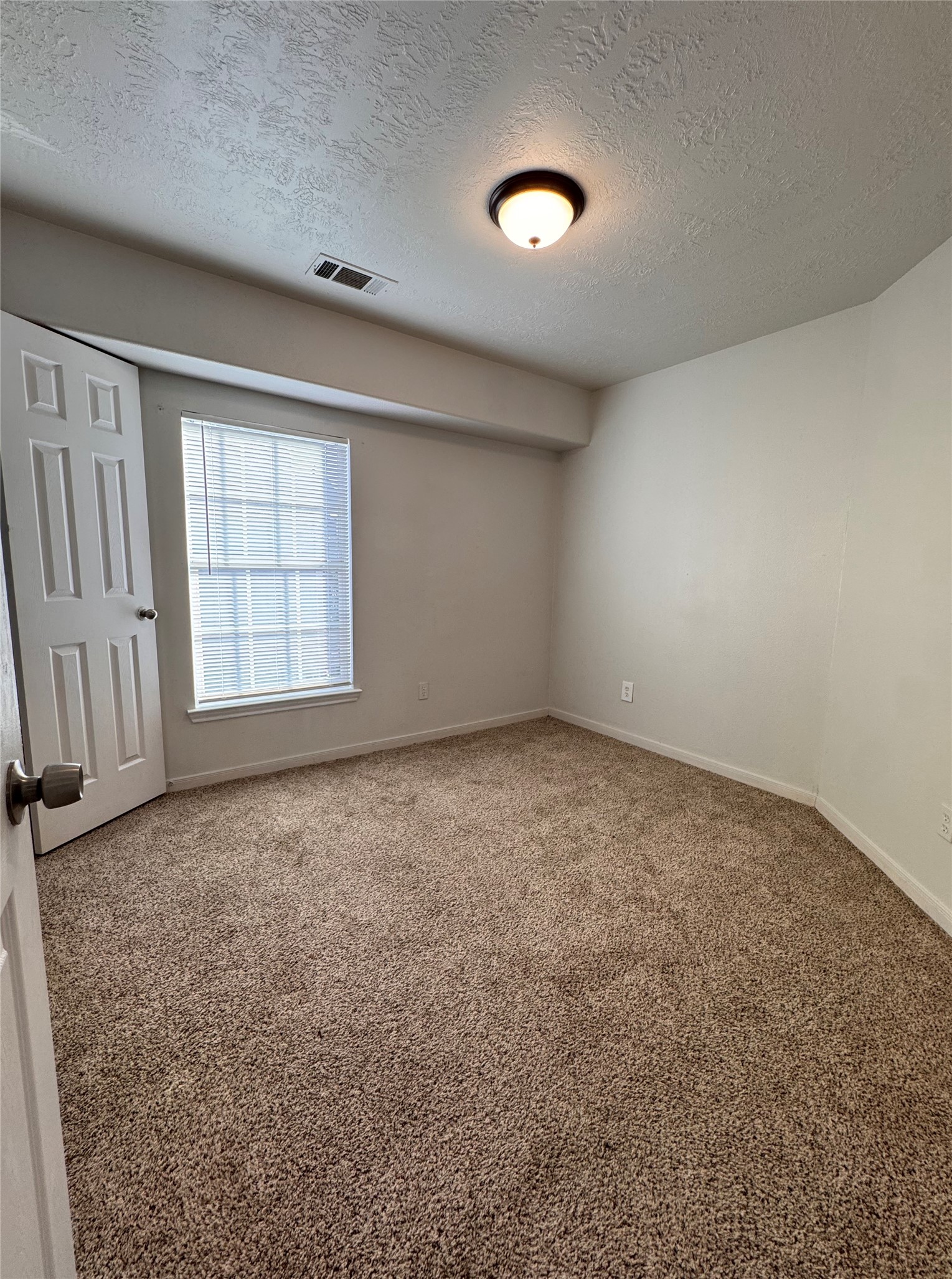 15931 Winston Point Lane Houston, TX 77084 - Photo 8 of 15 an empty room with windows