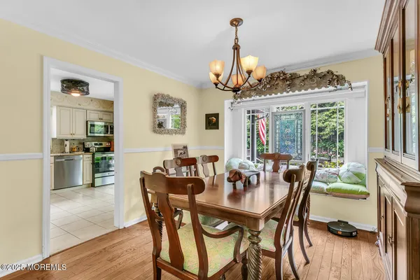 a view of a dining room with furniture window and outside view