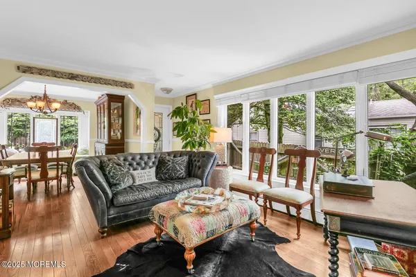a living room with furniture or couch and a floor to ceiling window