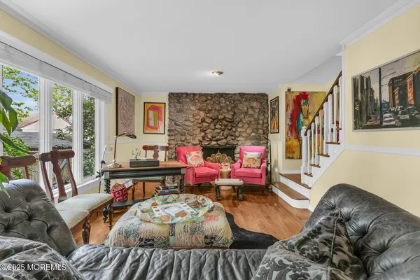a living room with furniture and flowers