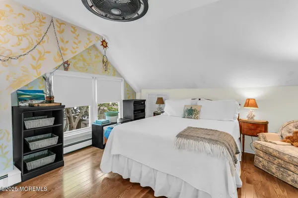 a bedroom with a bed and a desk