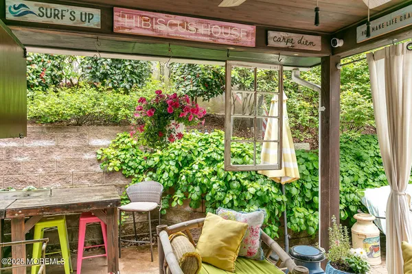 a outdoor living space with furniture and garden view