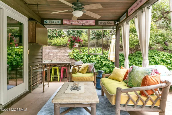 a view of a backyard with table and chairs