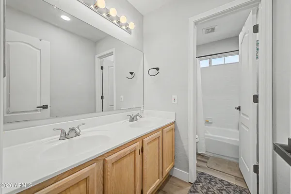 a bathroom with a sink a vanity and a mirror