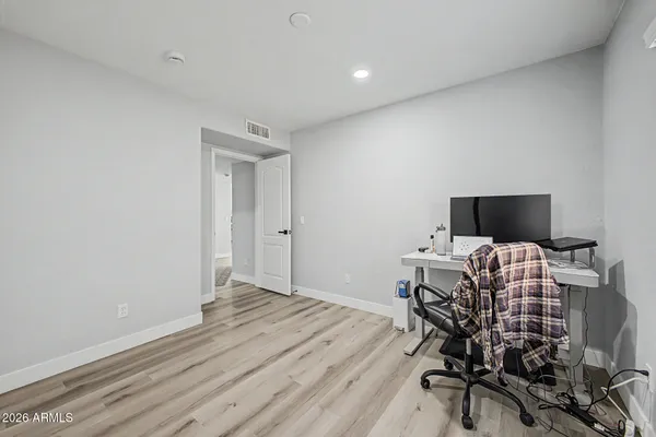 a view of a livingroom with furniture and a flat screen tv