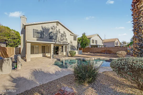 a view of a house with backyard