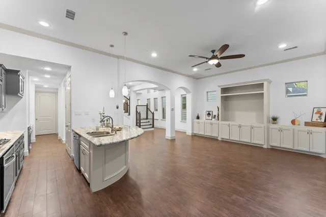 a view of a livingroom with furniture and a kitchen