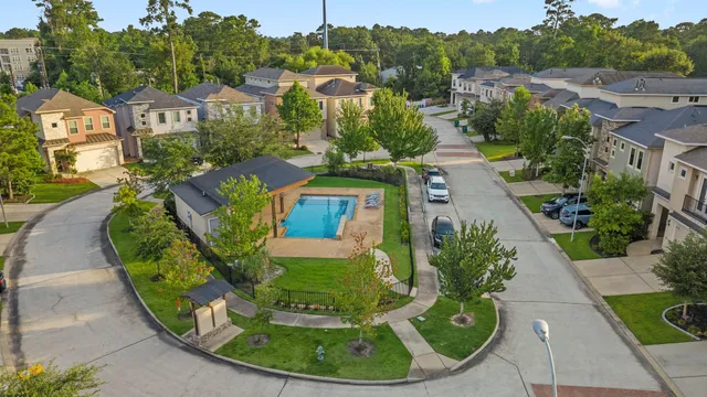 a view of a swimming pool with a yard