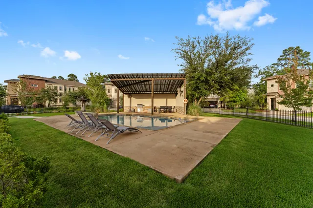 a view of a park with swings and slides