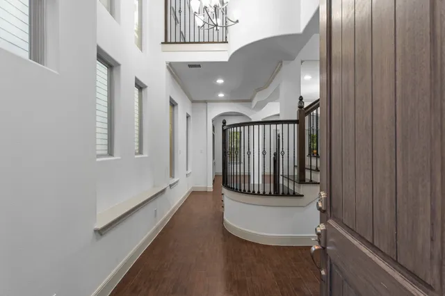 a view of entryway and hall with a front door