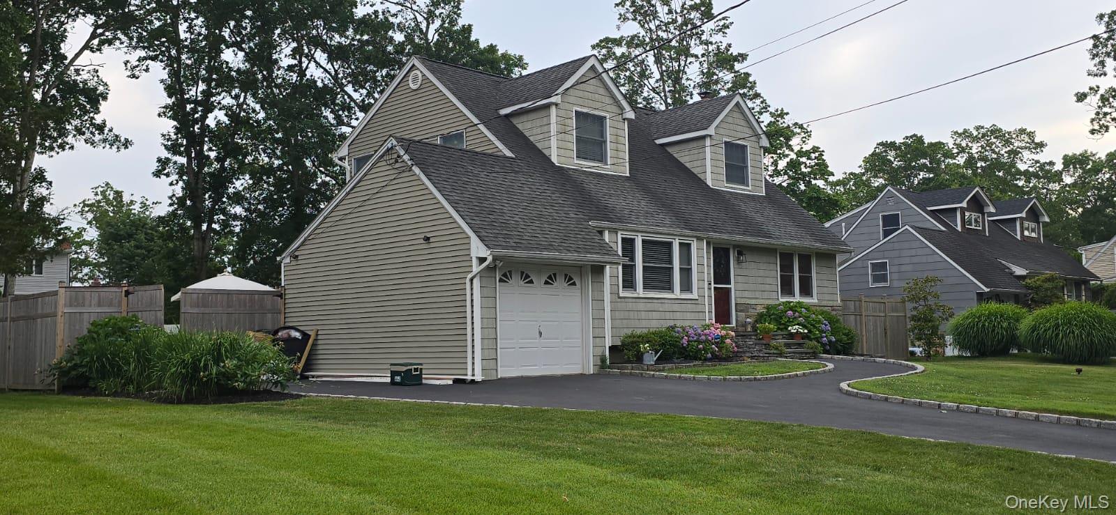 6 Robinson Street Shoreham, NY 11786 - Photo 1 of 28 a front view of a house with a garden