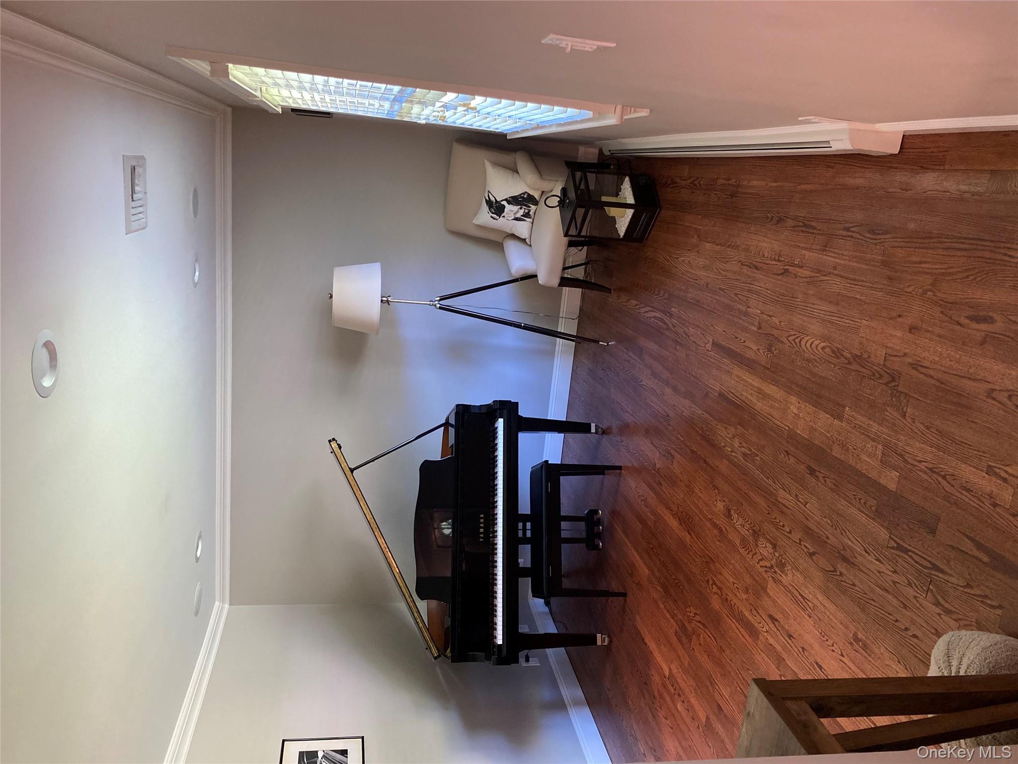 6 Robinson Street Shoreham, NY 11786 - Photo 11 of 28 a living room with furniture and a wooden floor