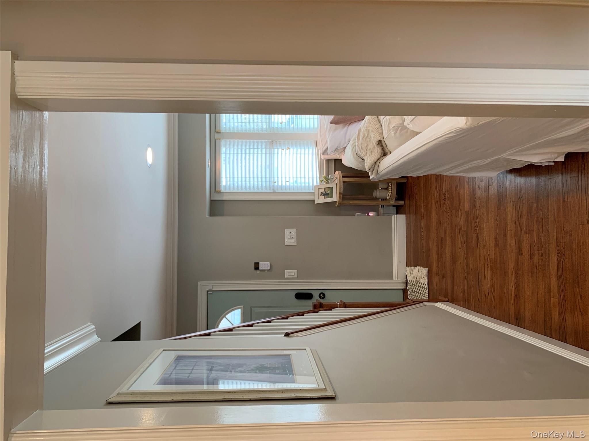 6 Robinson Street Shoreham, NY 11786 - Photo 12 of 28 a room with furniture and a window