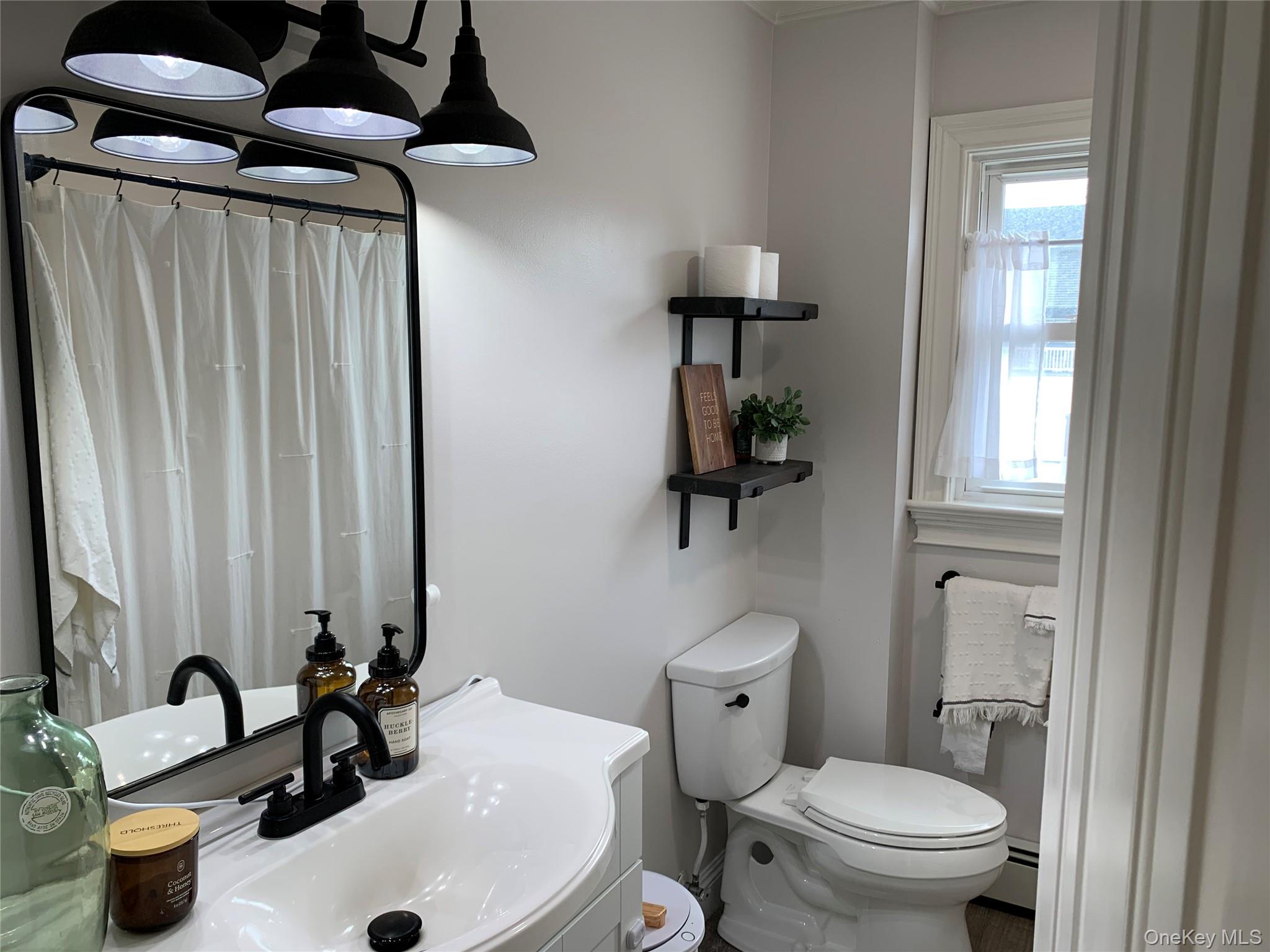 6 Robinson Street Shoreham, NY 11786 - Photo 15 of 28 a bathroom with a sink toilet and shower