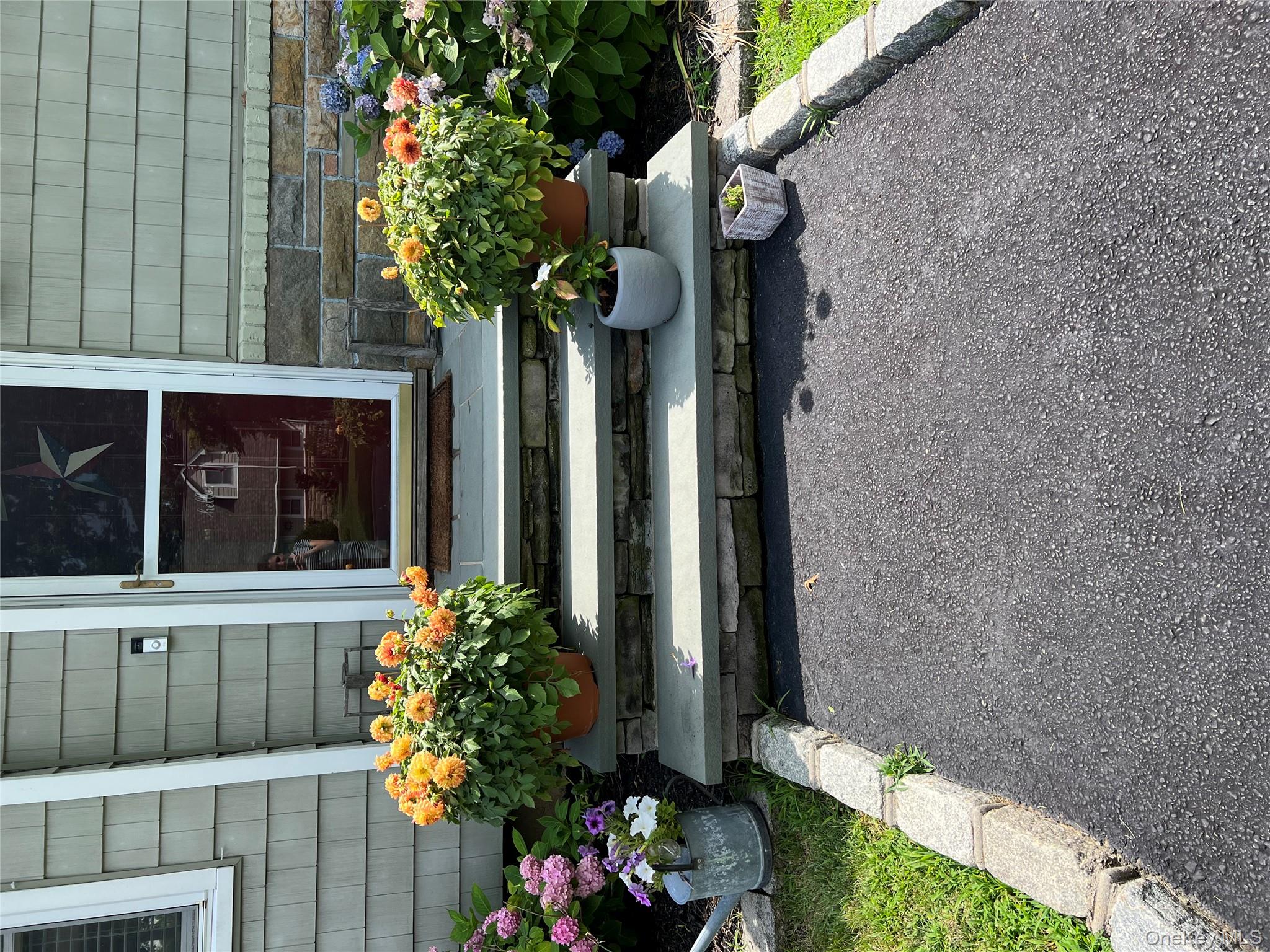 6 Robinson Street Shoreham, NY 11786 - Photo 2 of 28 a front view of a house with a yard