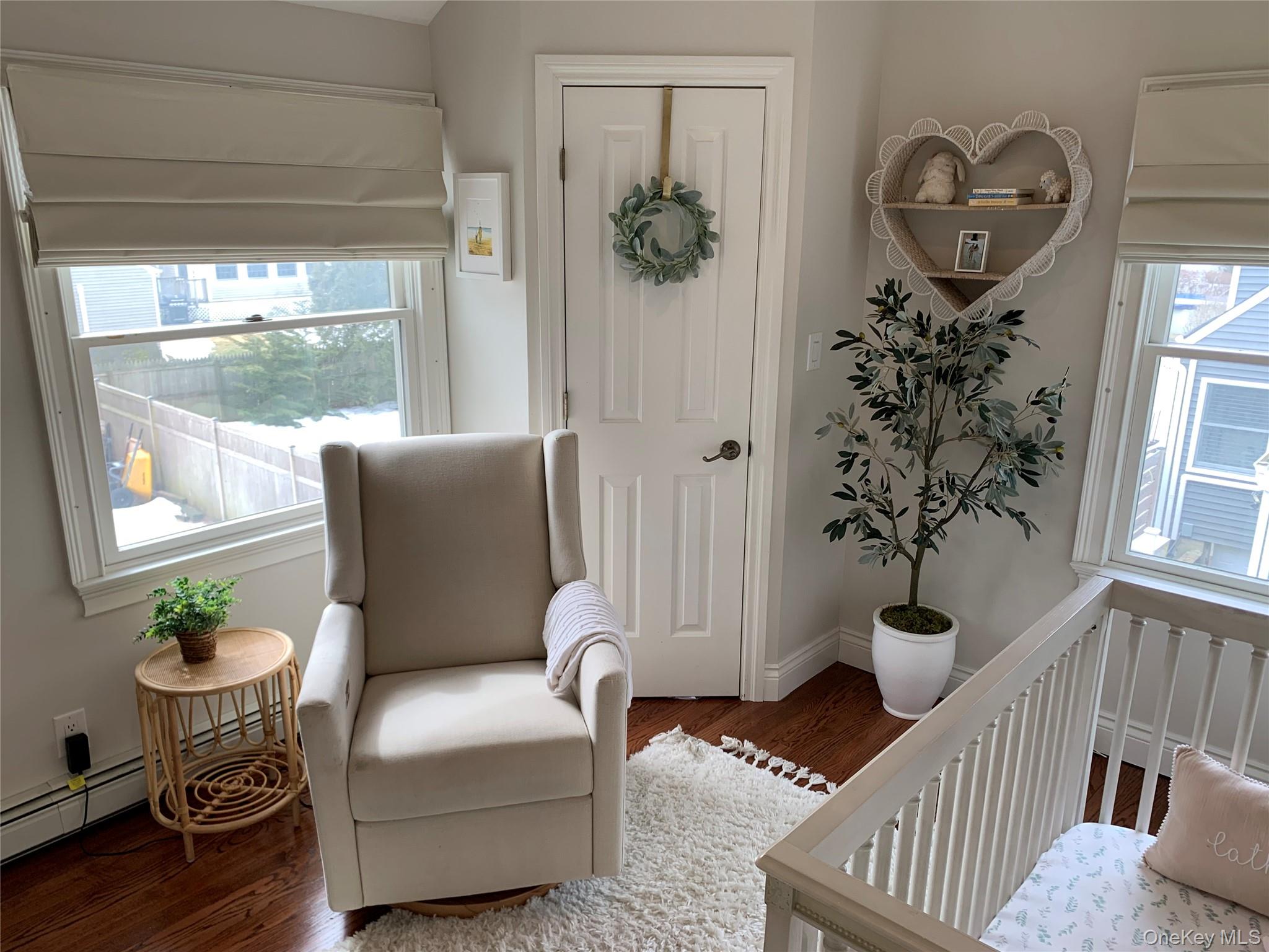 6 Robinson Street Shoreham, NY 11786 - Photo 22 of 28 a living room with furniture and wooden floor