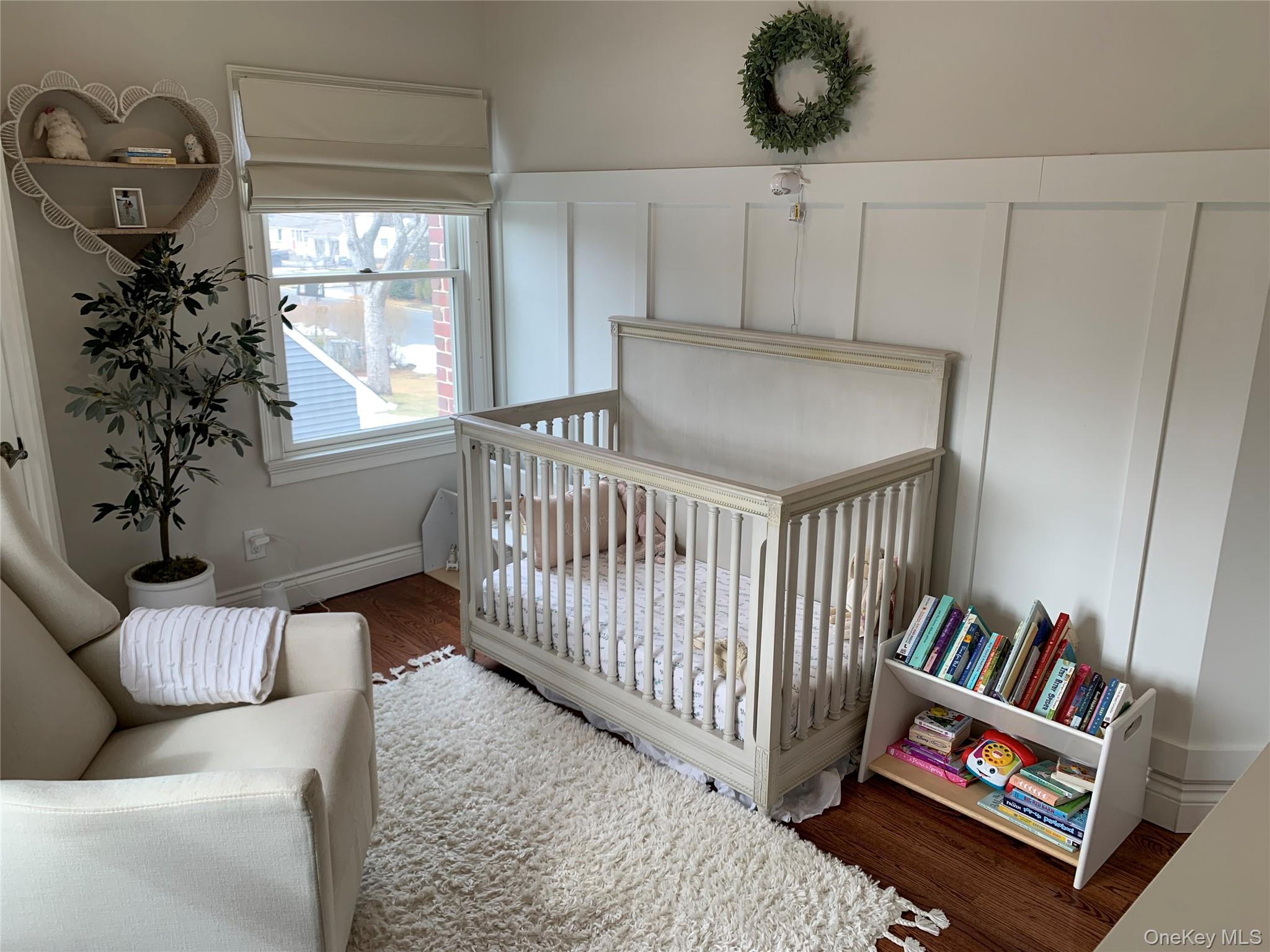 6 Robinson Street Shoreham, NY 11786 - Photo 23 of 28 a bedroom with furniture and a book shelf
