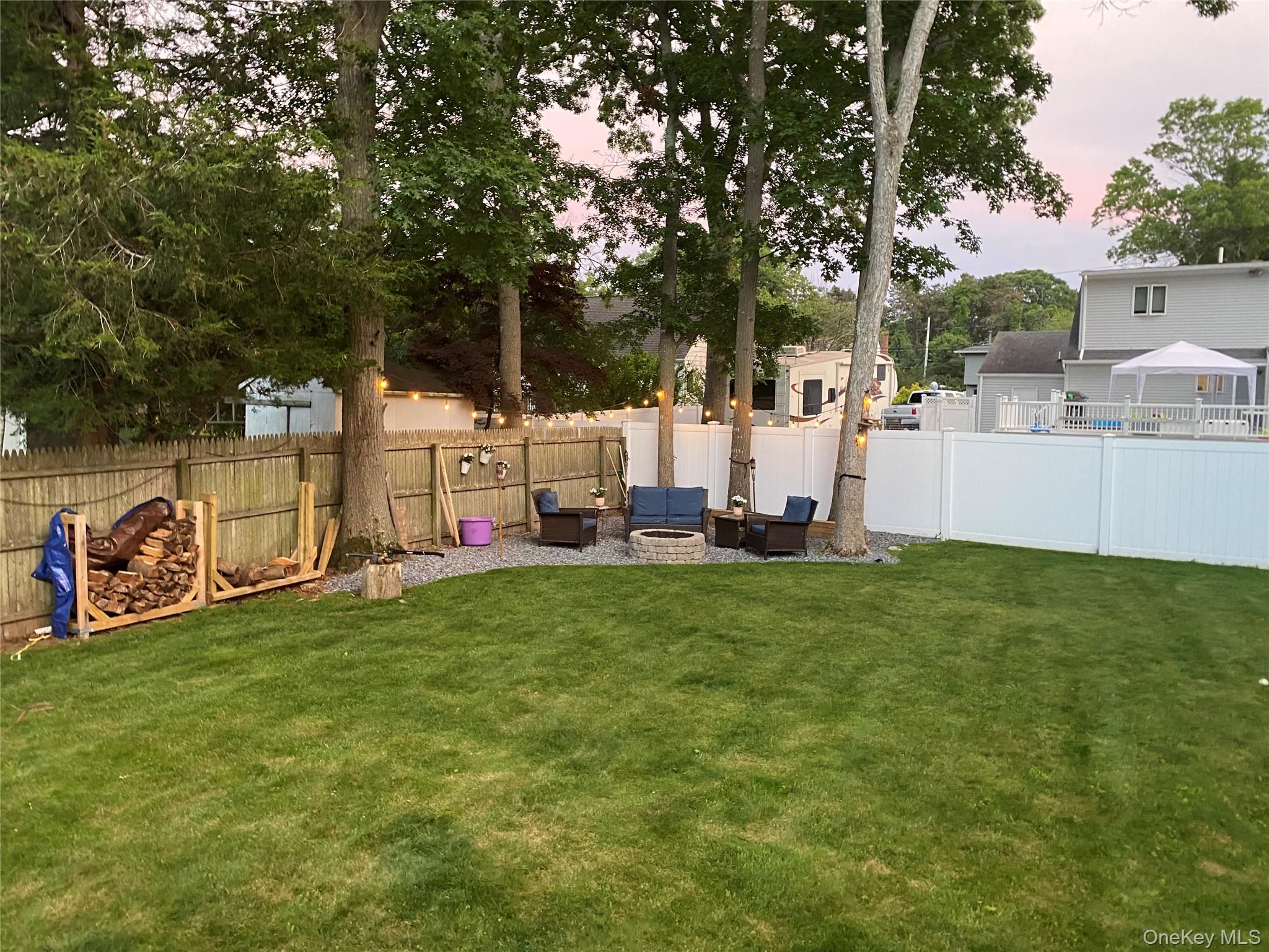 6 Robinson Street Shoreham, NY 11786 - Photo 26 of 28 a view of a backyard with large trees