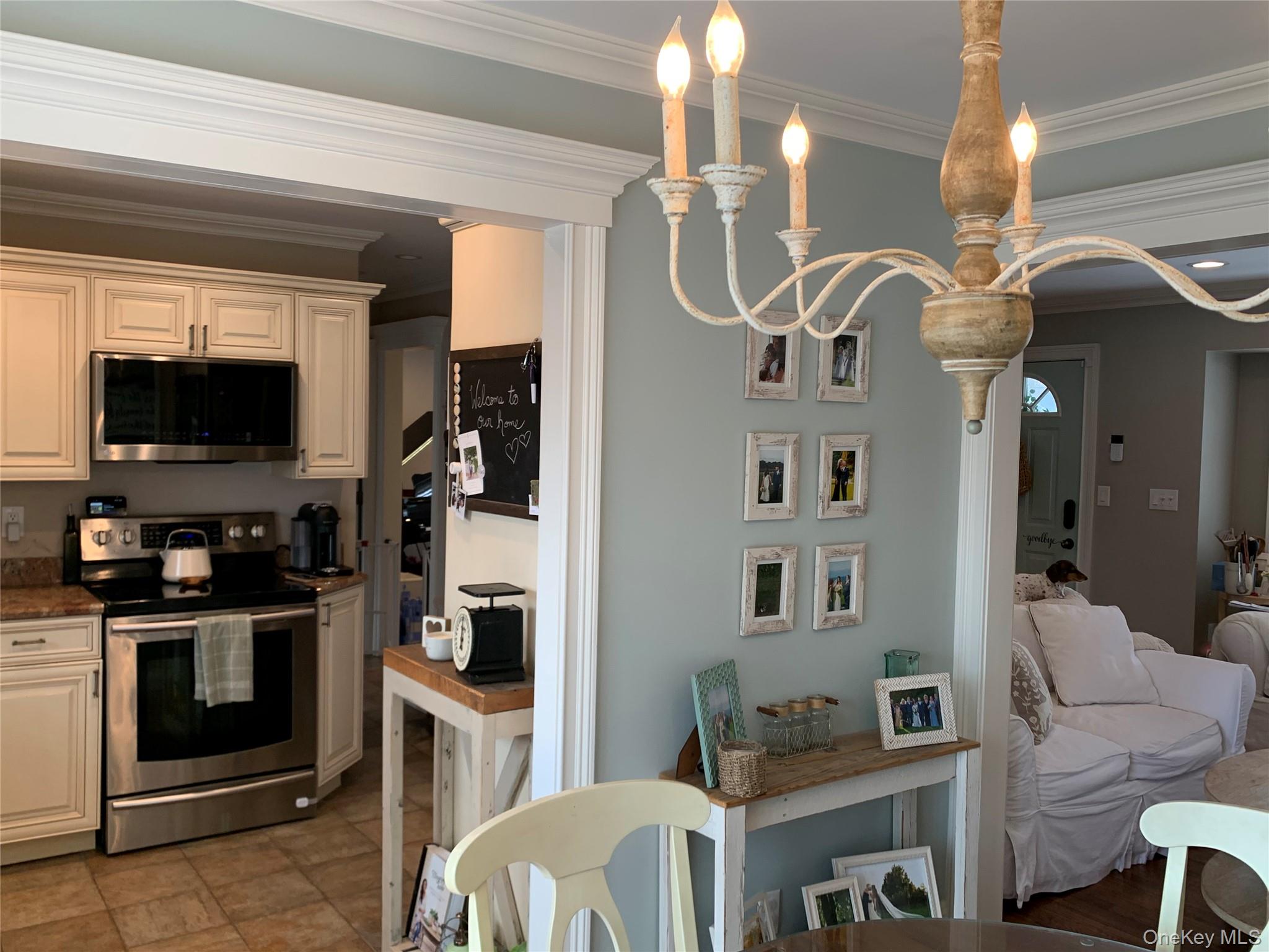 6 Robinson Street Shoreham, NY 11786 - Photo 8 of 28 a kitchen view of a dining table chairs and entryway