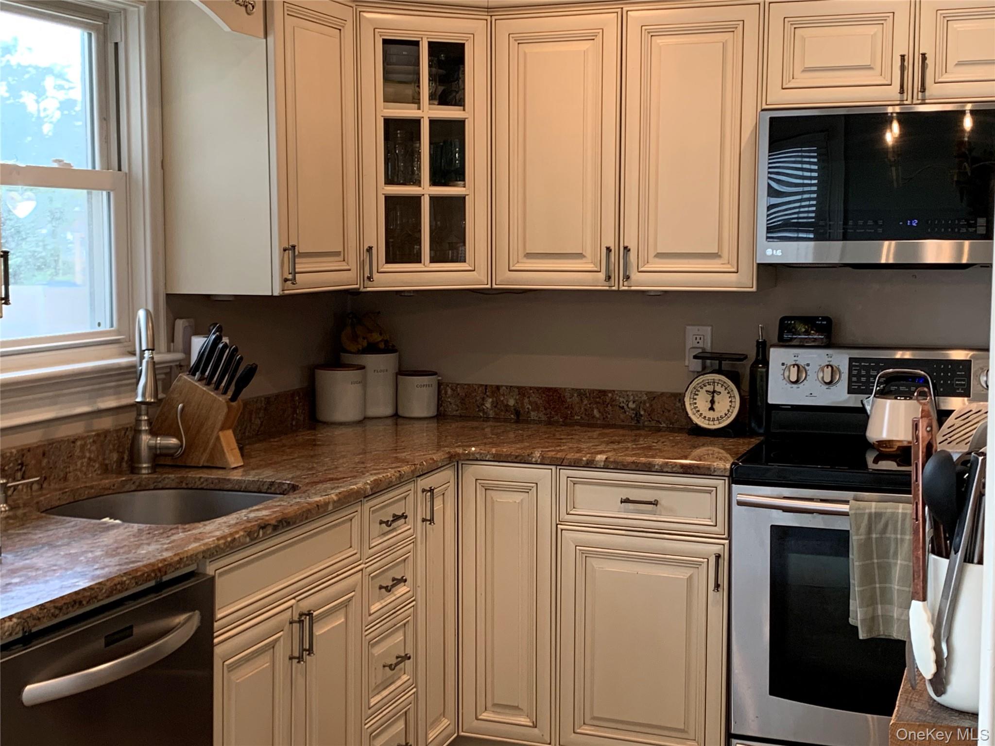 6 Robinson Street Shoreham, NY 11786 - Photo 9 of 28 a kitchen with cabinets appliances and a window