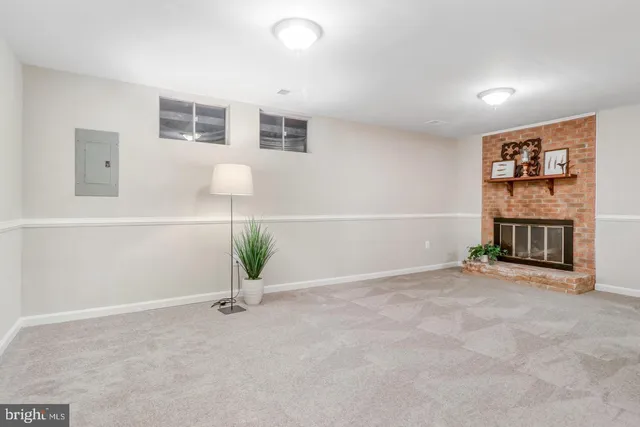 a view of room with a potted plant on the wall and a potted plant