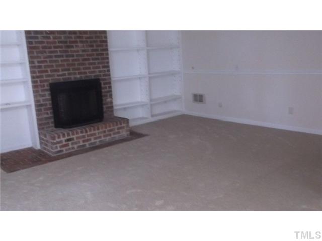7925 Netherlands Drive Raleigh, NC 27606 - Photo 10 of 14 master bedroom with fireplace