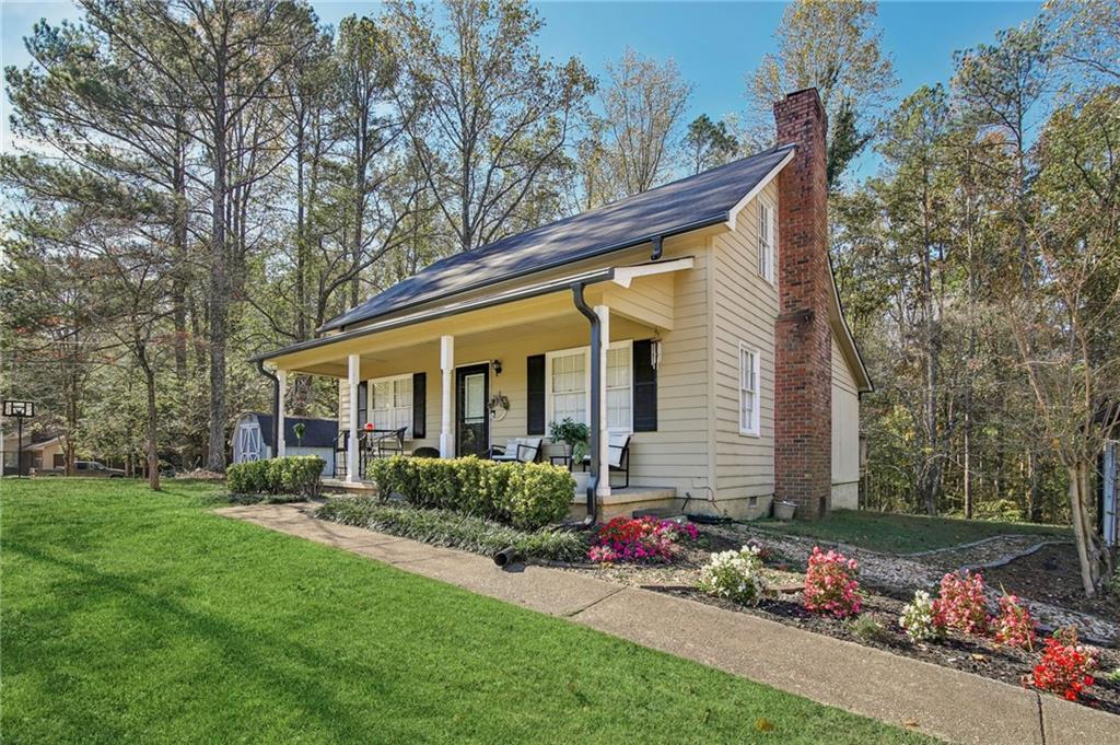 2116 Bobo Road Dallas, GA 30132 - Photo 1 of 1 a view of a house with a garden
