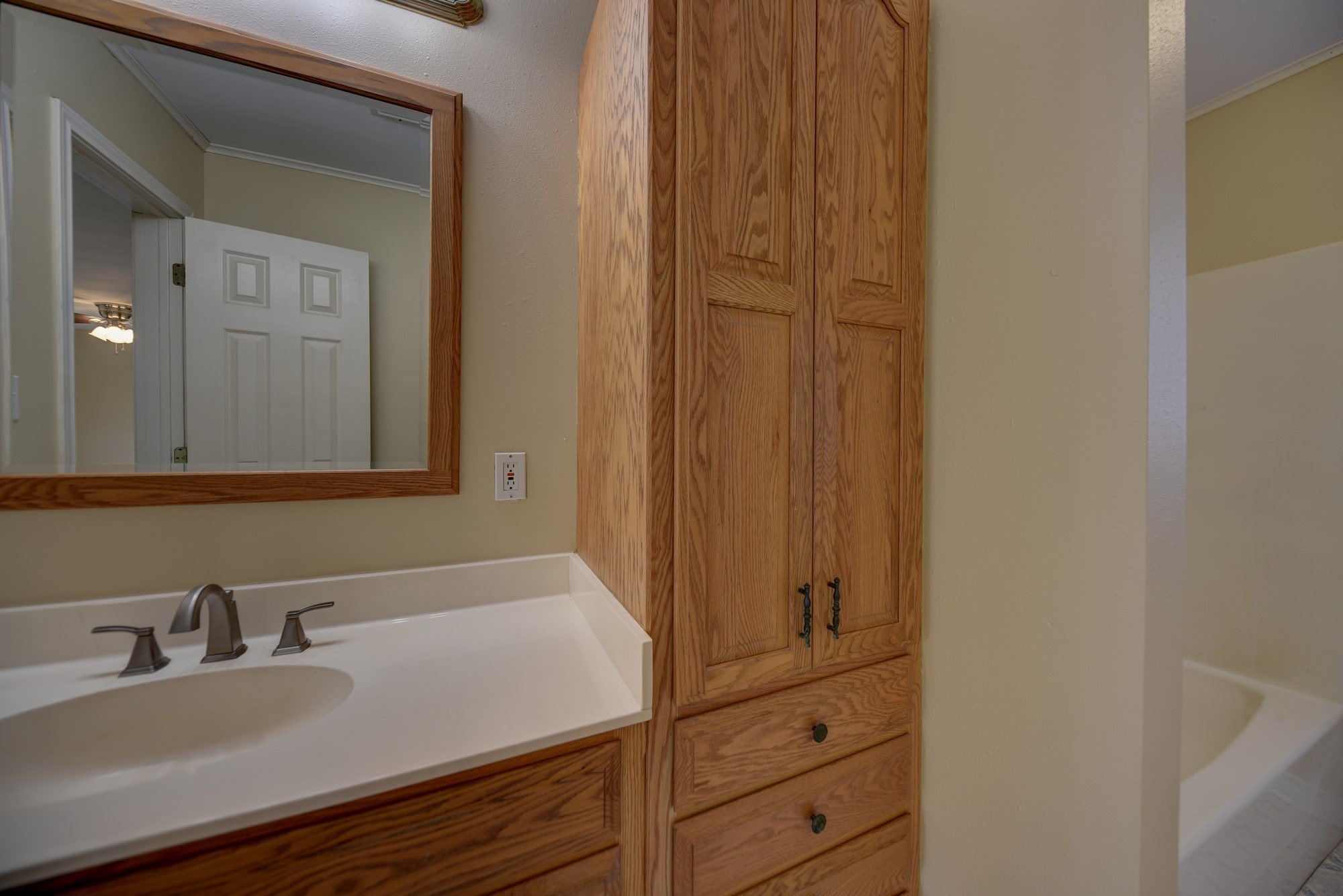 7009 Sandy Hill Road Brenham, TX 77833 - Photo 24 of 41 a bathroom with a sink and a mirror