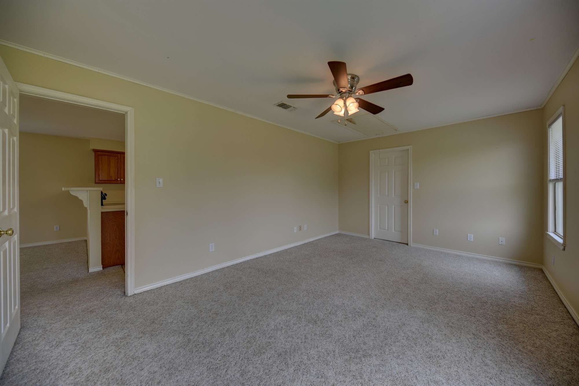 7009 Sandy Hill Road Brenham, TX 77833 - Photo 26 of 41 a view of a livingroom with a ceiling fan and window